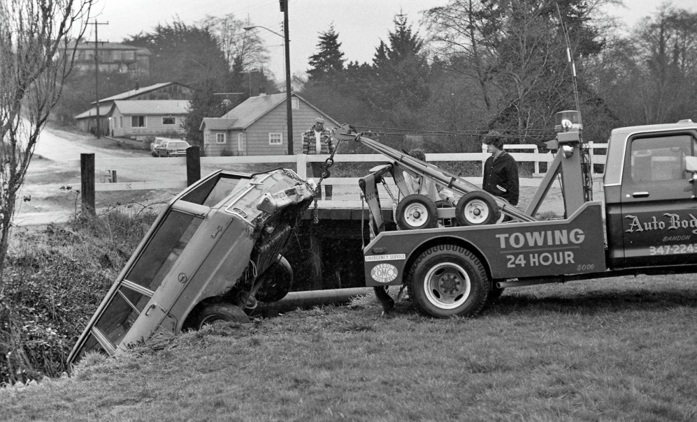 Wrecker pulling auto out of Ferry Creek, 1979