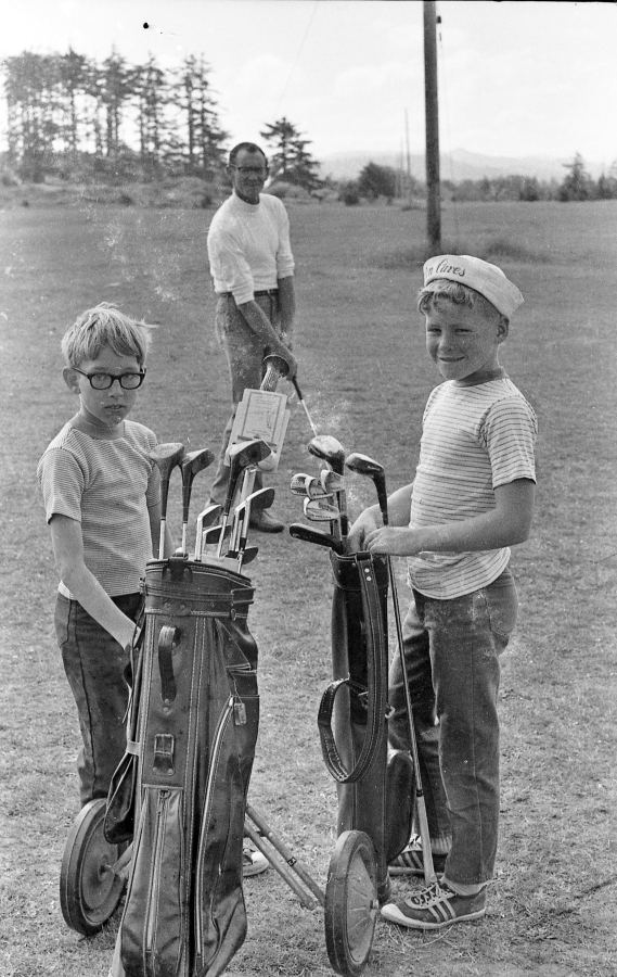 Jim Curran with two golf students