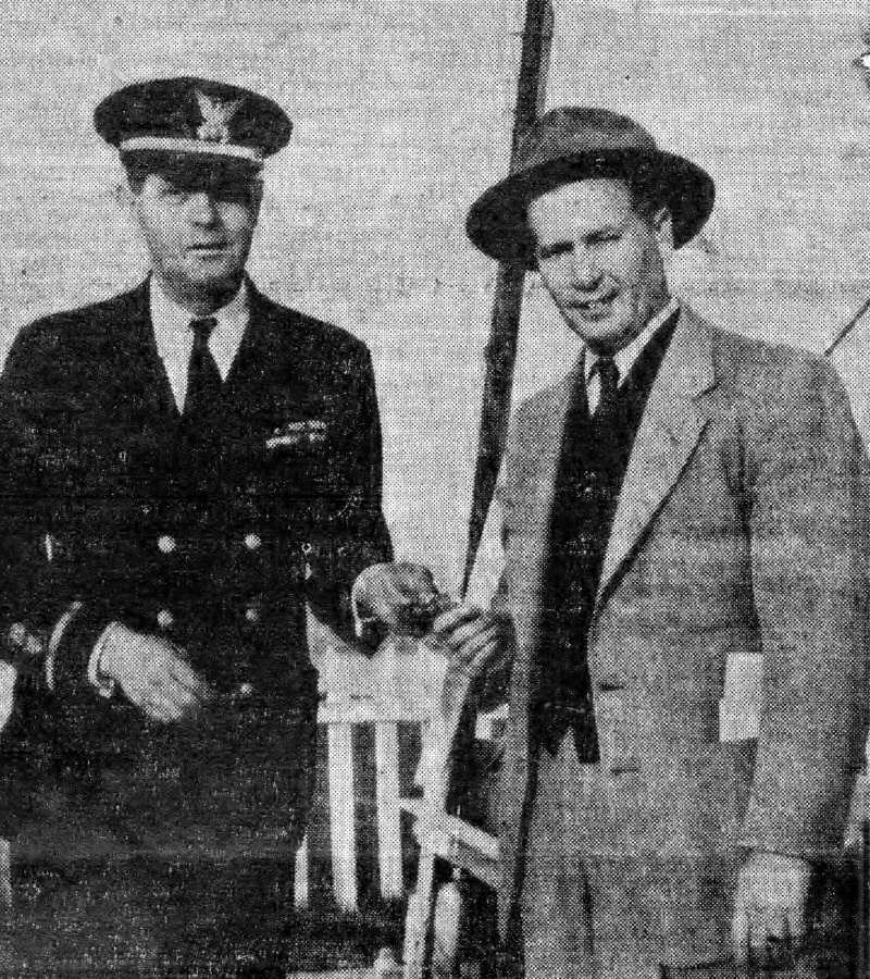 Local defense commander Claude E. Waldrop (right)