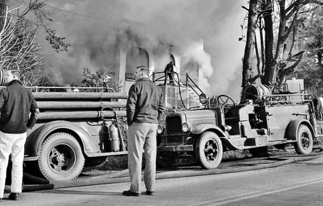 Firemen battle a blaze, 1956